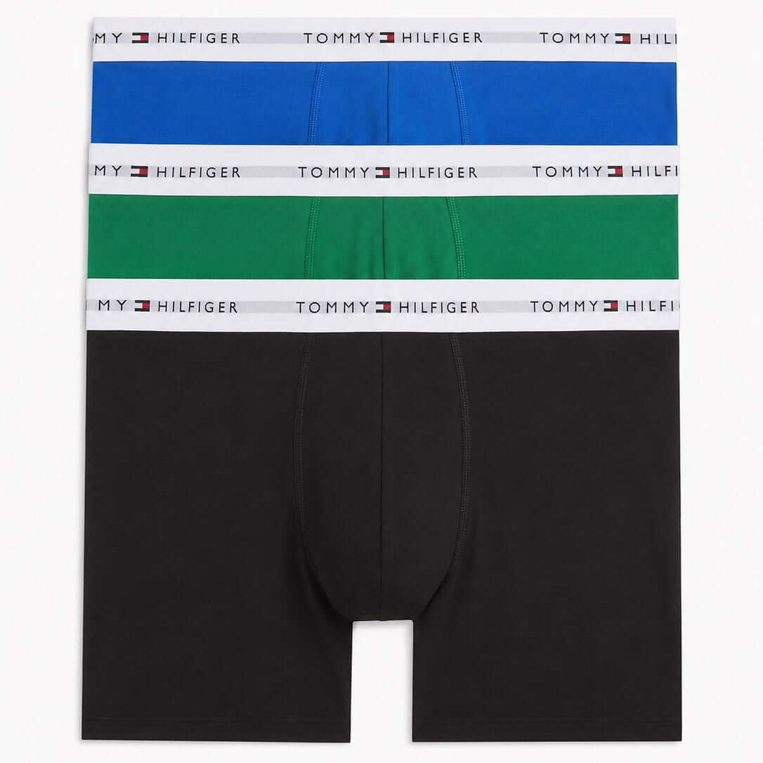 Three pairs of Tommy Hilfiger men's boxer briefs stacked vertically, featuring black, green, and blue fabrics with white waistbands printed with the brand name.
