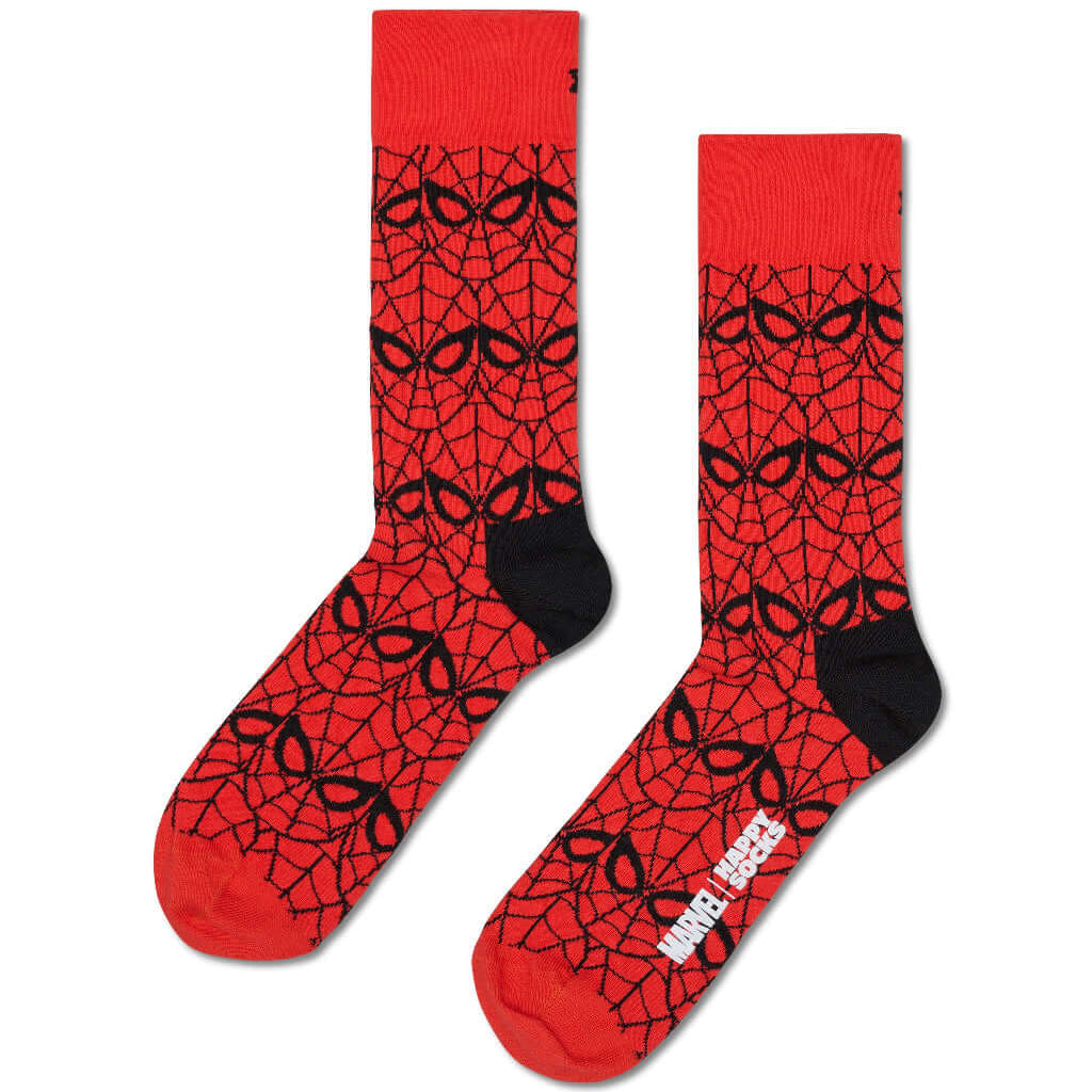 A pair of crew socks featuring a red and black spider-themed web pattern, with black heels and toes and a white Marvel logo on the sole.