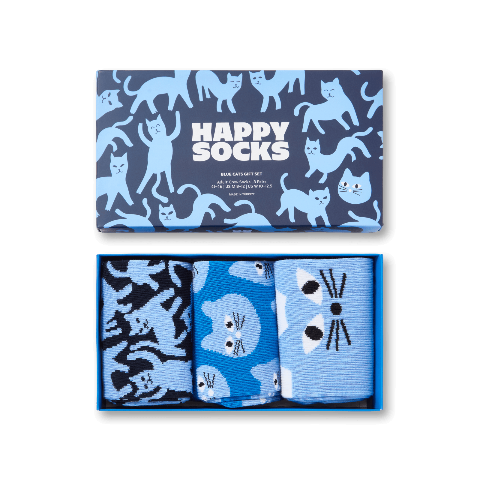 A boxed gift set of three pairs of socks with a blue and navy cat pattern. The top lid shows the brand 'Happy Socks' and the three pairs inside feature different cat-face and cat-pattern designs in shades of blue, navy, and black.