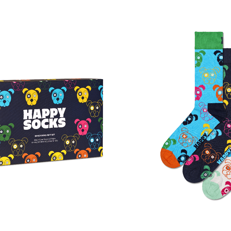 Happy Socks brand sock gift set featuring a dark navy box with colorful cartoon bear faces and the words 'HAPPY SOCKS' in white, alongside three pairs of patterned crew socks in blue, navy, and white with multicolored bear faces and orange toes.