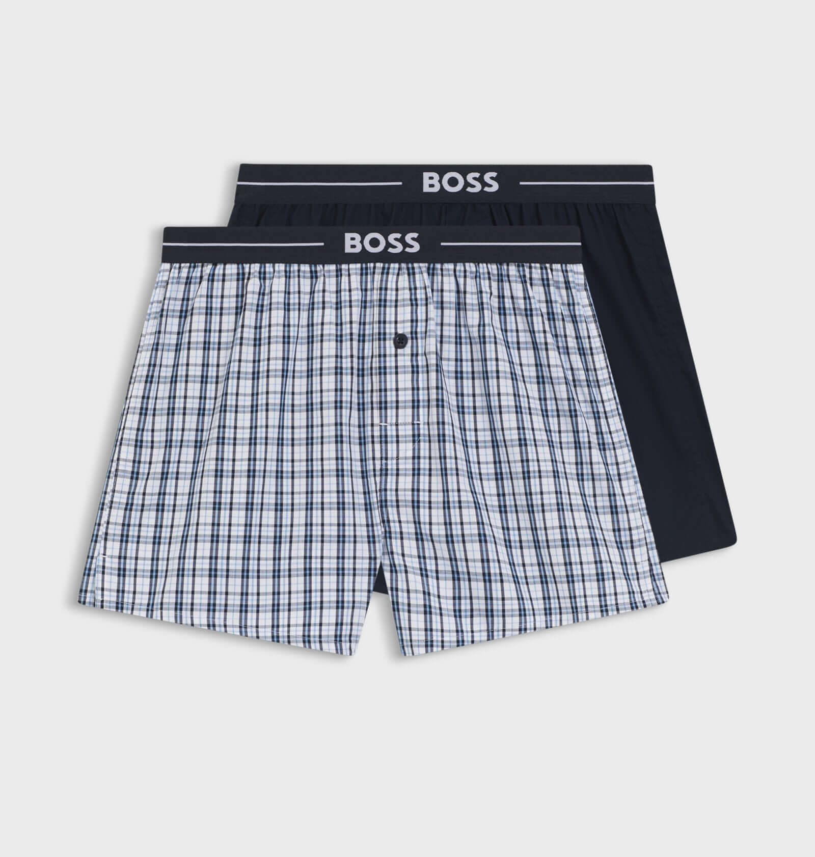 Two pairs of boxer shorts with a checkered pattern and black waistband on a white background, branded 'BOSS'.
