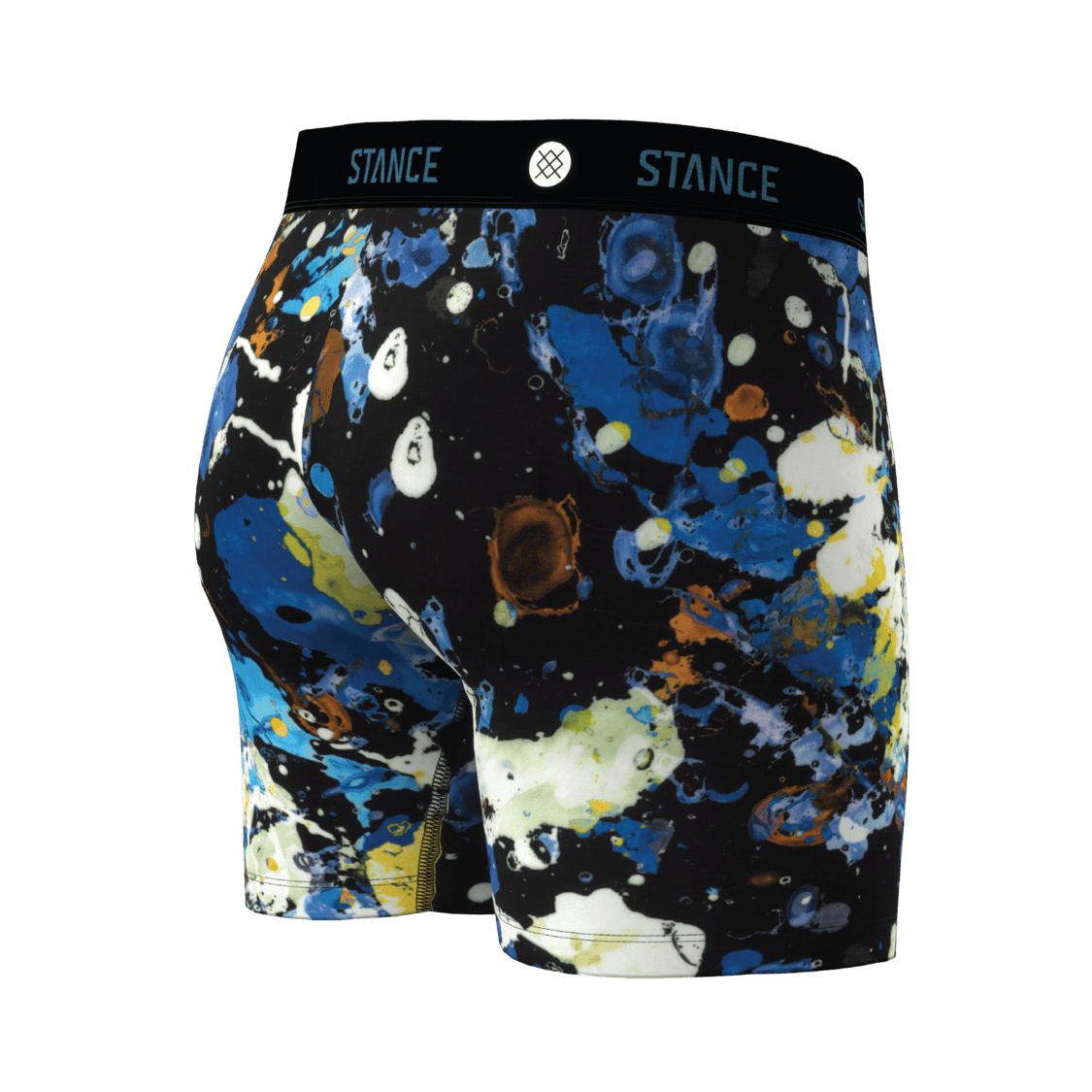 Men's boxer briefs featuring a vibrant blue, white, and black abstract paint splatter pattern, with a black elastic waistband displaying the 'STANCE' brand logo.