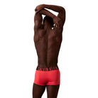 Calvin Klein Intense Power Low Rise Microfibre Trunks – coral rear view on model