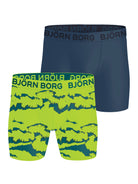Two pairs of Björn Borg boxer briefs, one navy and one green with shark pattern, on a white background.
