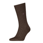 Brown sock with a small logo on a white background