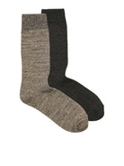 Two socks, one gray and one black, on a white background