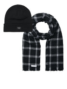Black beanie and plaid scarf set on a white background