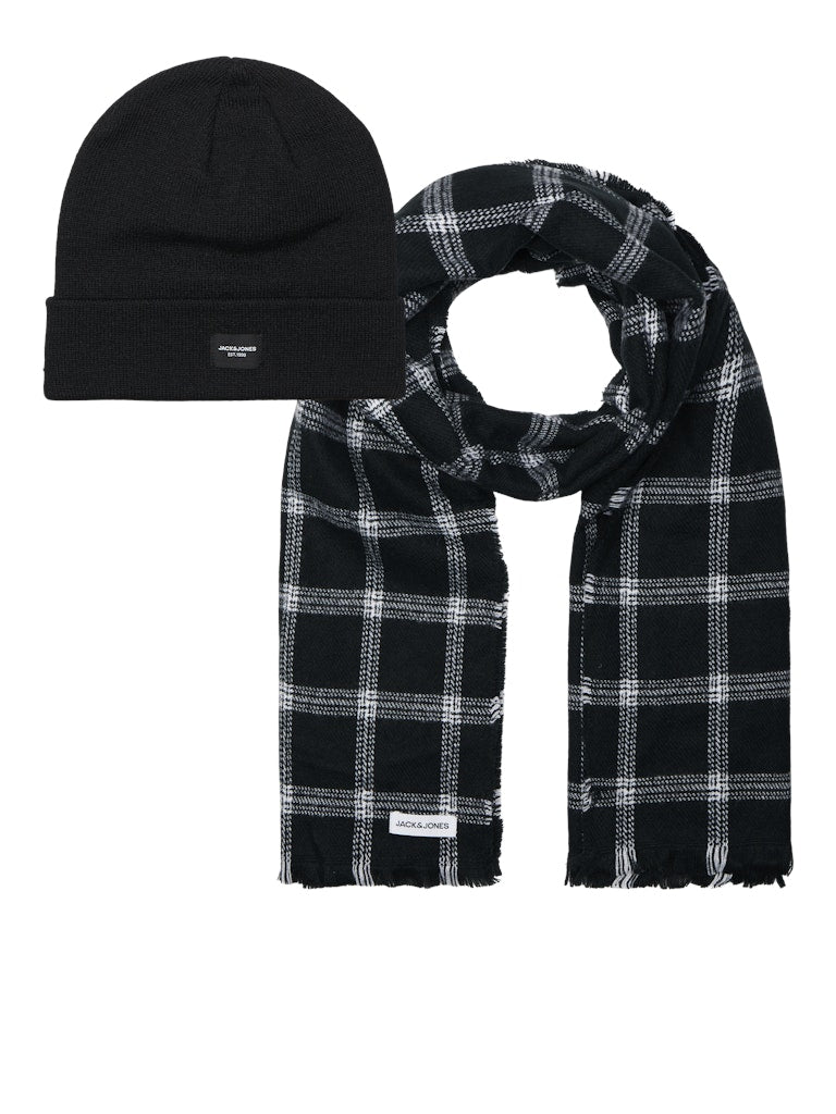 Black beanie and plaid scarf set on a white background
