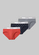 Three pairs of Calvin Klein underwear in red, navy, and gray on a white background.