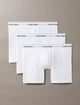 Three pairs of Calvin Klein white boxer briefs on a beige background