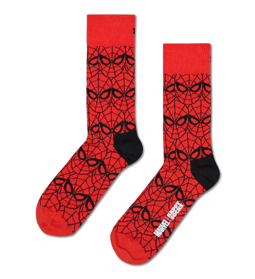 A pair of crew socks featuring a red and black spider-themed web pattern, with black heels and toes and a white Marvel logo on the sole.