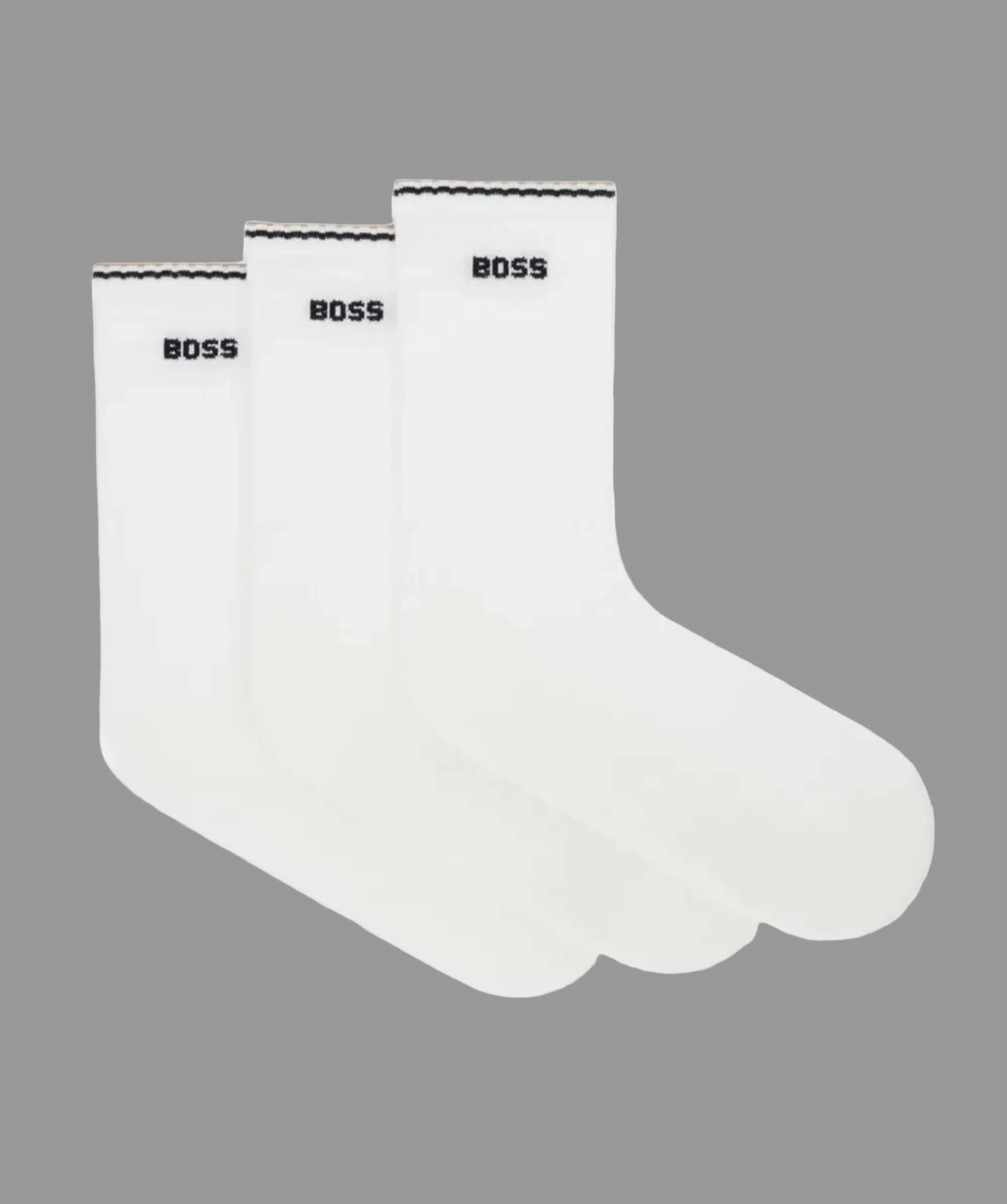 Two white t-shirts with 'BOSS' branding on a light gray background