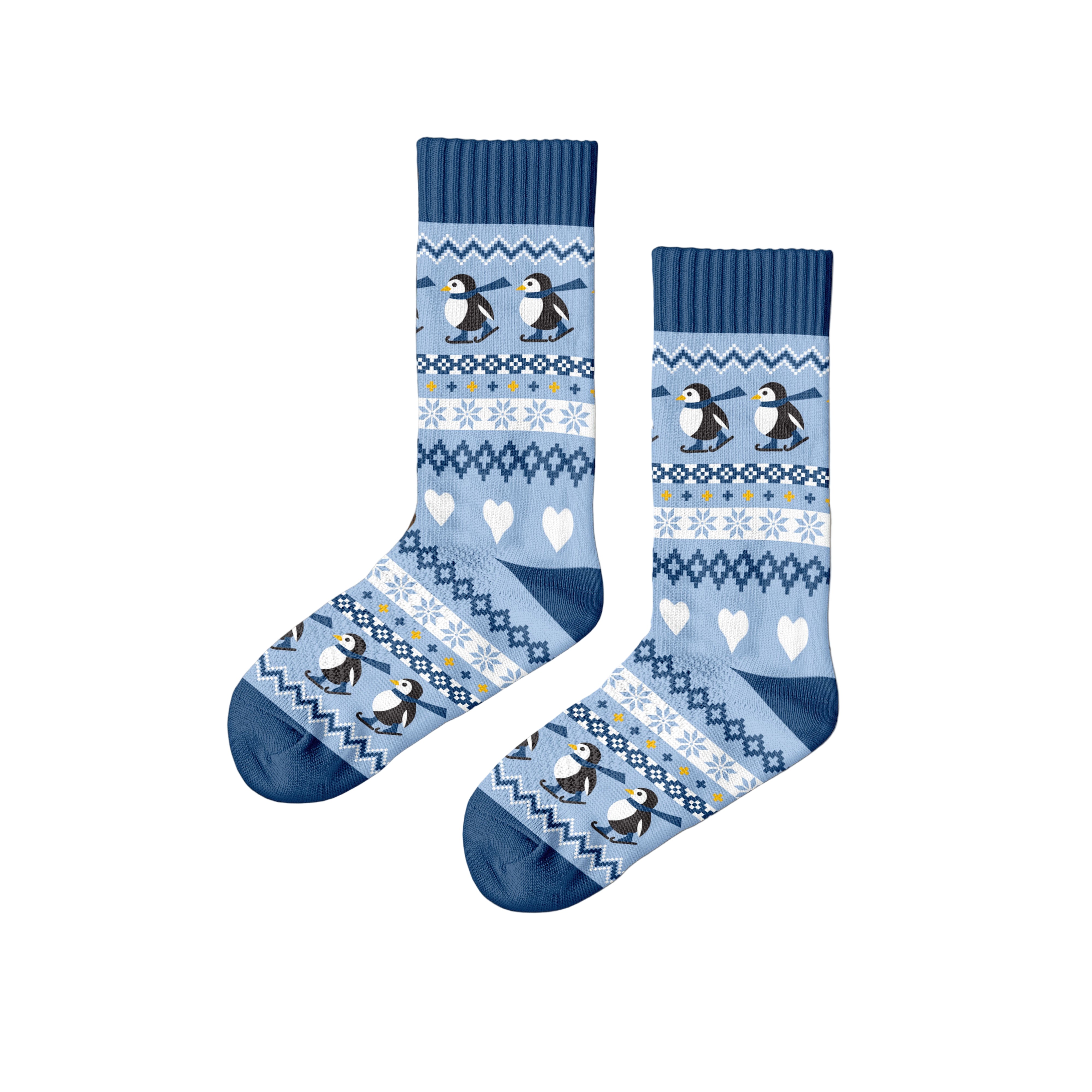 Pair of blue socks with penguin design on a wooden surface, featuring the brand 'Polar Star'.