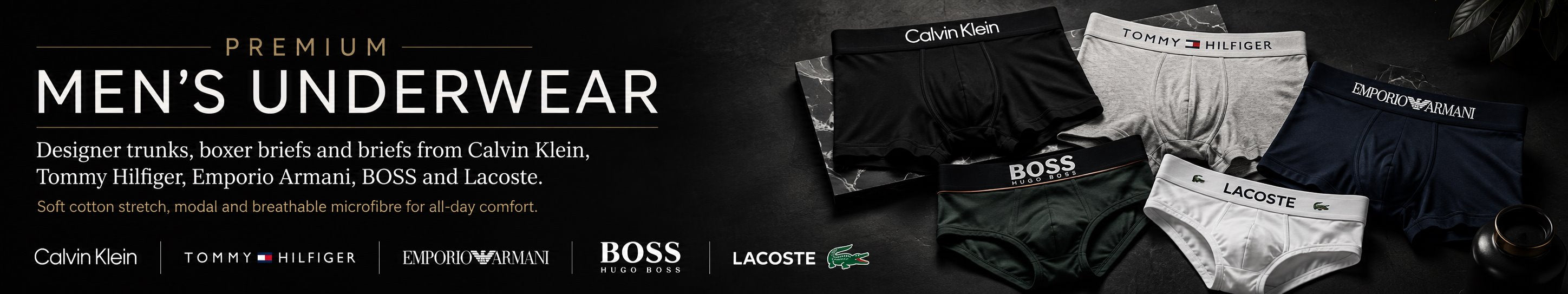 Premium men’s underwear collection banner featuring Calvin Klein, Tommy Hilfiger, Emporio Armani, BOSS and Lacoste designer trunks, boxer briefs and briefs on a dark luxury background.