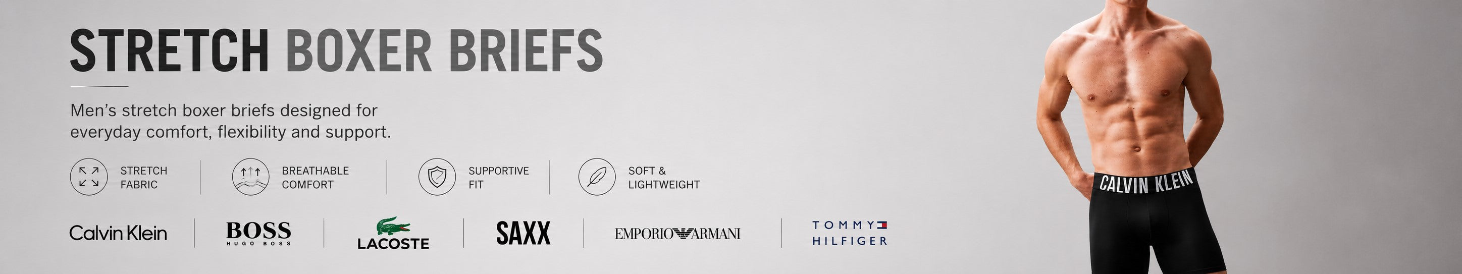 Stretch boxer briefs collection banner featuring a male model in black Calvin Klein boxer briefs with comfort, flexibility and support highlights, plus Calvin Klein, Boss, Lacoste, SAXX, Emporio Armani and Tommy Hilfiger logos.