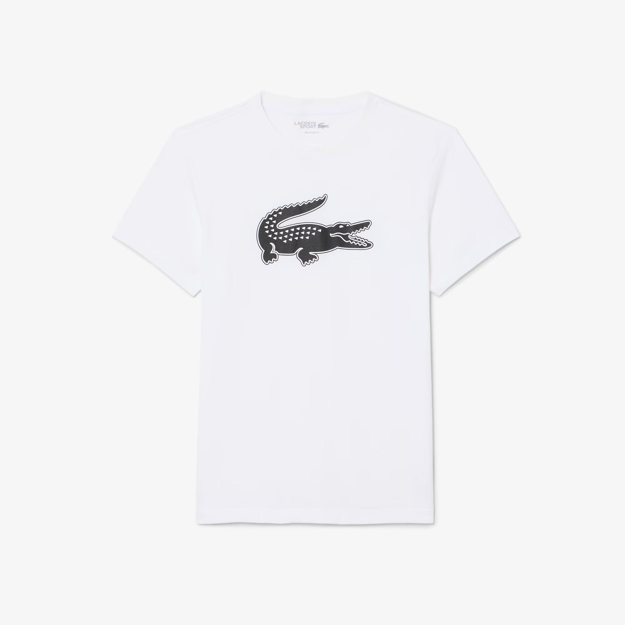 A white short-sleeve crewneck t-shirt featuring the signature Lacoste crocodile logo in black and white on the center chest, displayed flat against a light gray background.