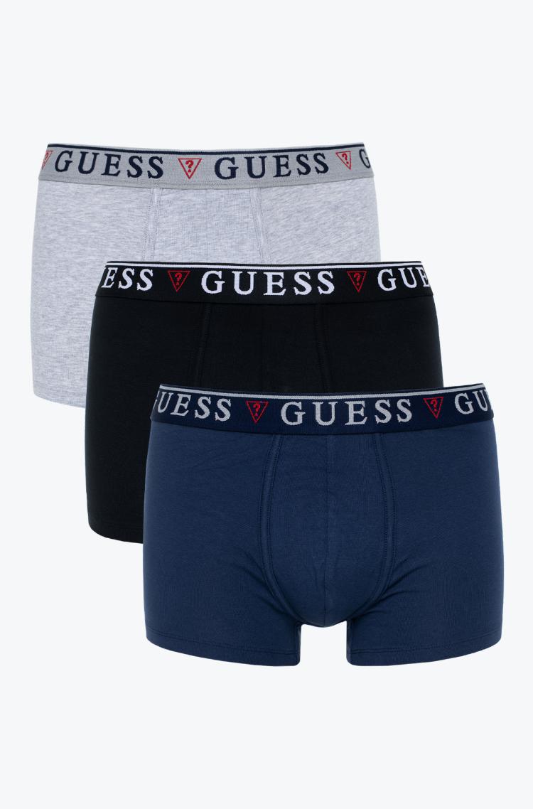 Three pairs of Guess boxer briefs in gray, black, and navy on a white background.