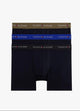 Black boxer briefs with a blue waistband on a white background, featuring Tommy Hilfiger branding.