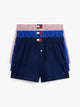 Navy blue boxer shorts with a red, white, and blue waistband on a light gray background