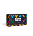 A rectangular gift box for a socks set, featuring a dark navy background covered in colorful cartoon sock-puppet faces and large white text reading 'HAPPY SOCKS'.