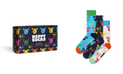 Happy Socks brand sock gift set featuring a dark navy box with colorful cartoon bear faces and the words 'HAPPY SOCKS' in white, alongside three pairs of patterned crew socks in blue, navy, and white with multicolored bear faces and orange toes.